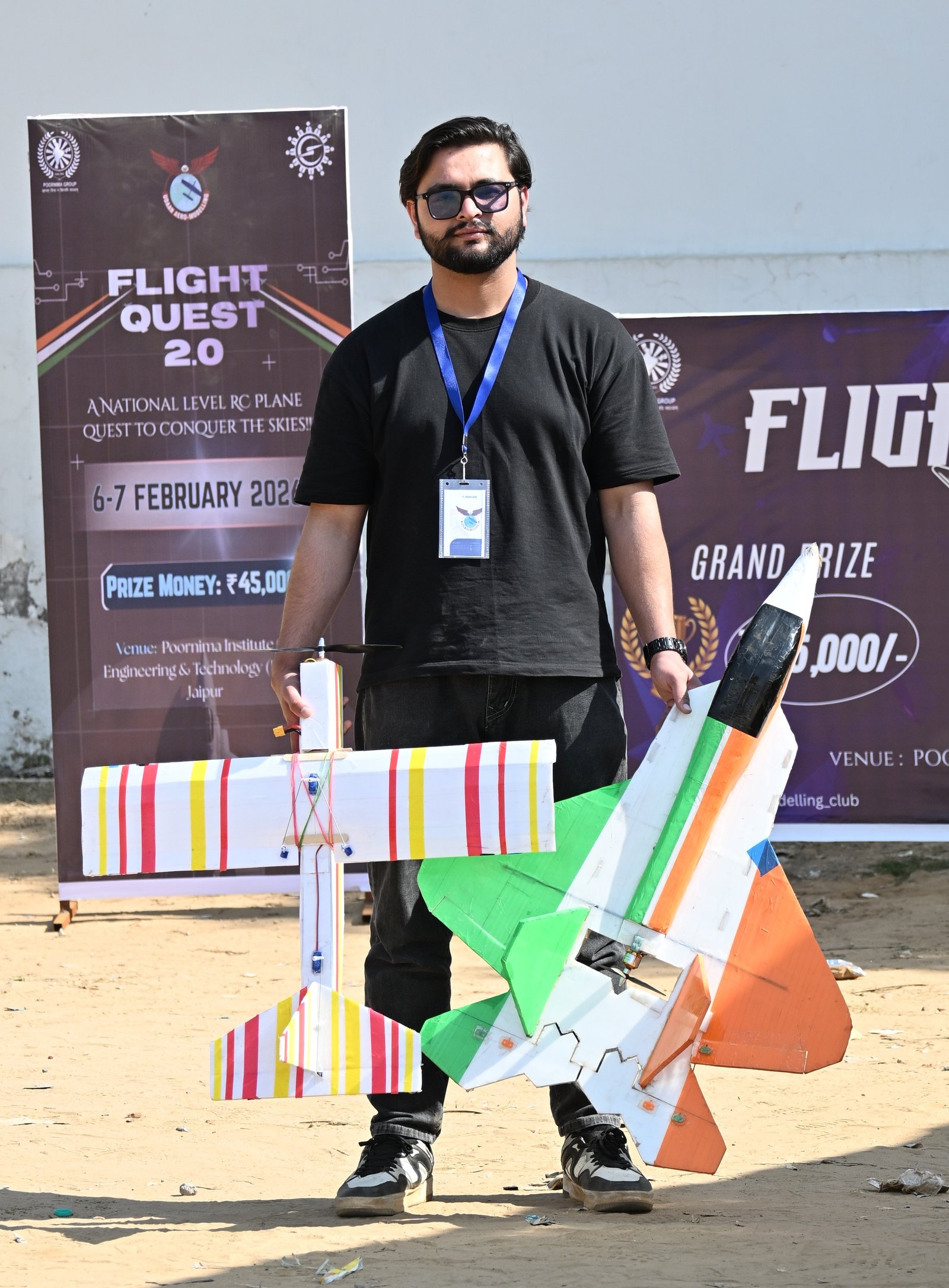 Mohammad Fahad Siddiqui holding RC aircraft at Flight Quest 2.0, Poornima Institute of Technology
